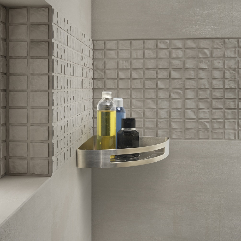 product lifestyle image of origins living gedy nerva brushed stainless steel corner shower basket